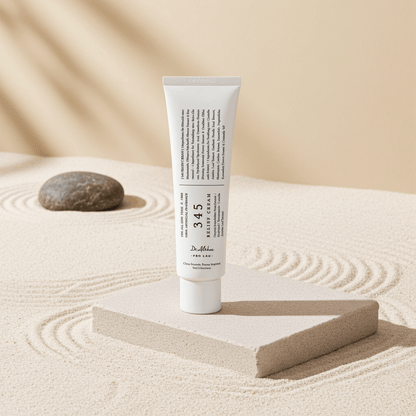 Tube of cream on a sand-like surface with a stone and wooden block